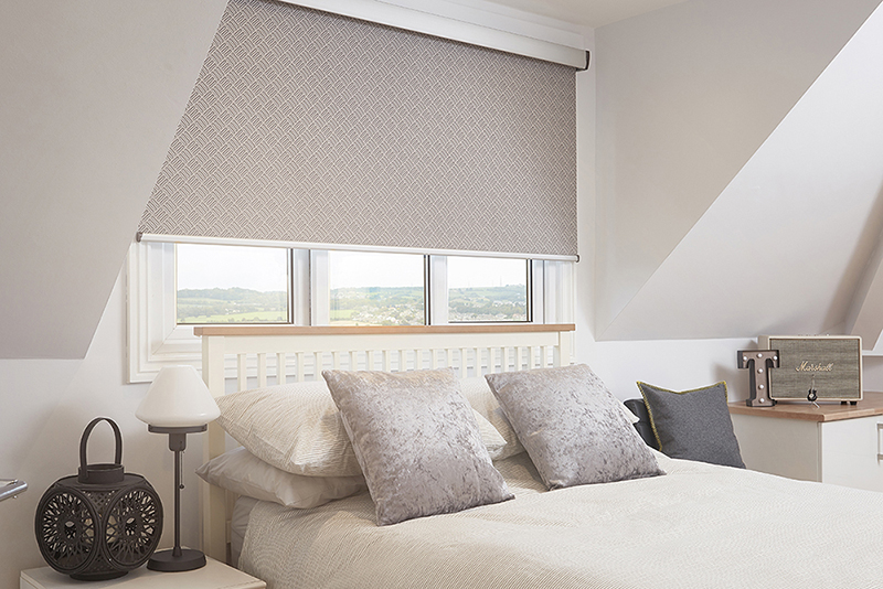 Bright bedroom with textured roller blinds